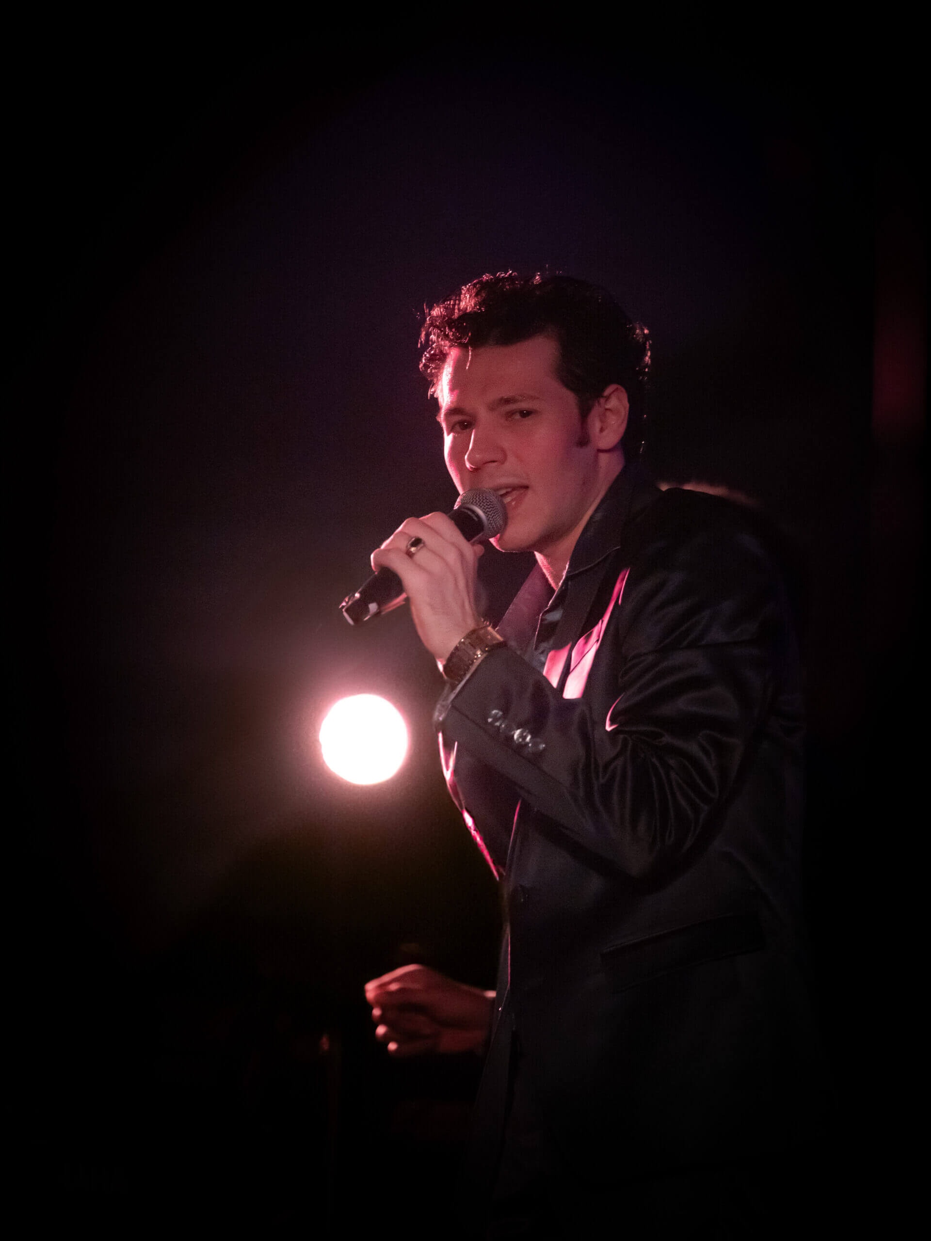 Peter Lemongello Jr. performing on stage