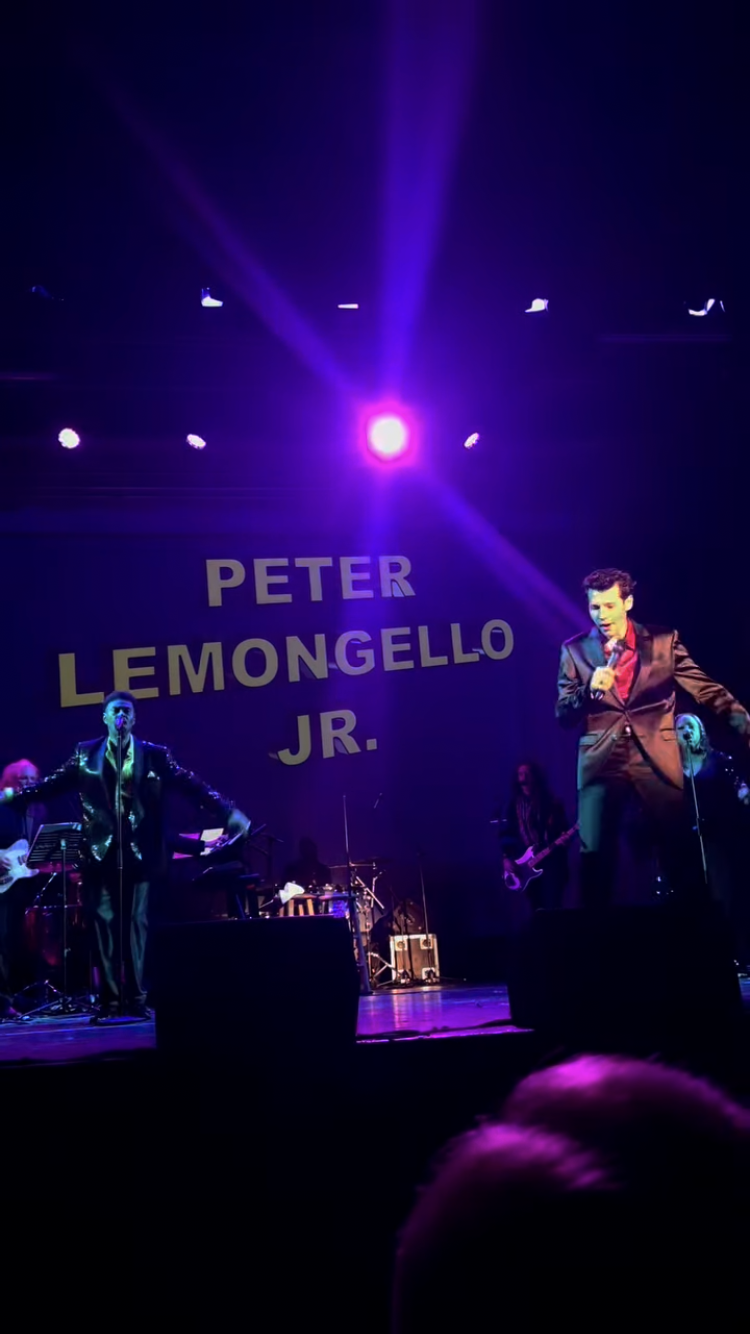 Peter performing on stage with orchestra
